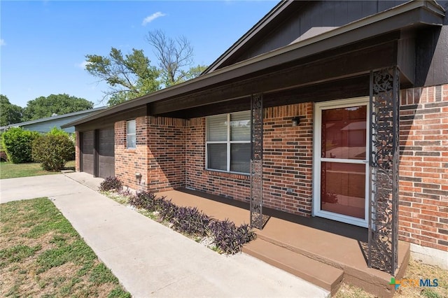 view of exterior entry featuring a garage