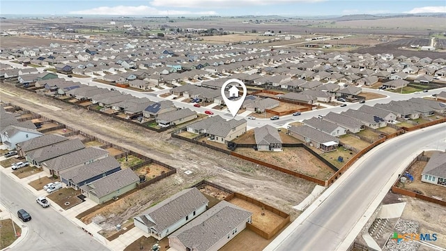 birds eye view of property with a residential view