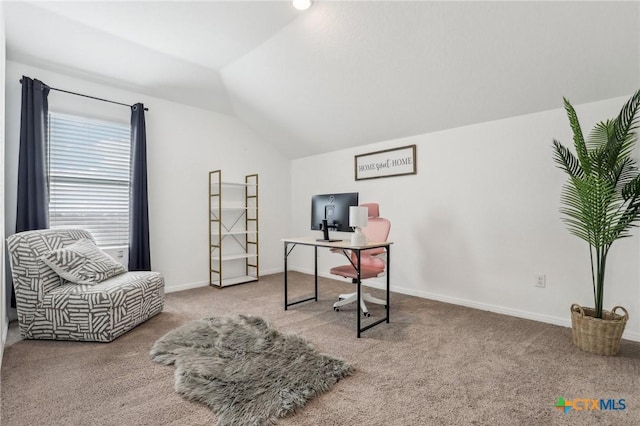 home office featuring carpet, vaulted ceiling, and baseboards