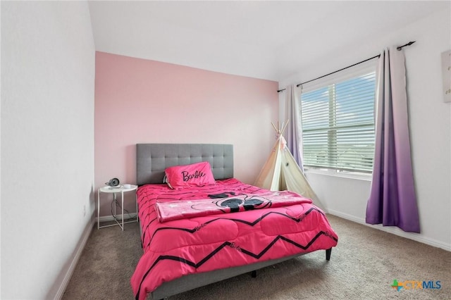 bedroom featuring carpet floors and baseboards