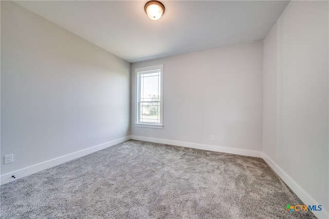 spare room featuring carpet flooring