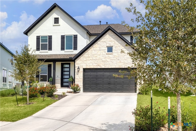 1965 Alasio Dr, Leander, TX 78641 - view of front of house featuring stone siding, stucco siding, a front lawn, and a shingled roof