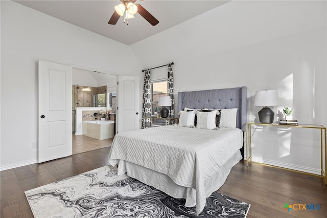 bedroom featuring lofted ceiling, baseboards, ensuite bath, hardwood / wood-style floors, and ceiling fan