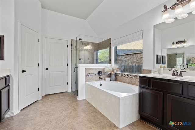 full bath with a shower stall, a garden tub, vanity, and a healthy amount of sunlight