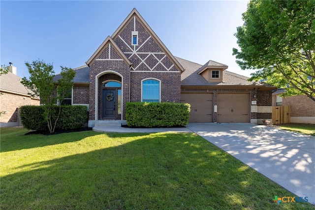 view of front of property with a front lawn, brick siding, an attached garage, a shingled roof, and concrete driveway