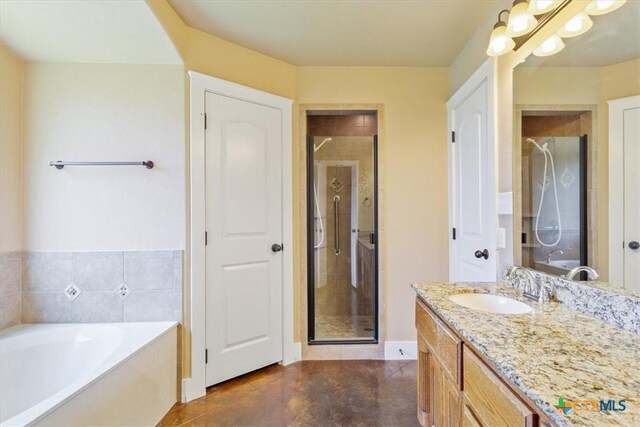 703 Cosper Creek Dr, Killeen, TX 76542 - bathroom with a stall shower, vanity, a bath, and finished concrete flooring