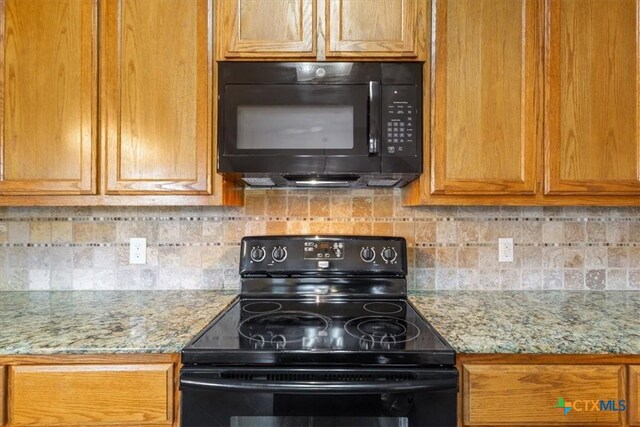703 Cosper Creek Dr, Killeen, TX 76542 - kitchen featuring black appliances, backsplash, brown cabinetry, and light stone counters