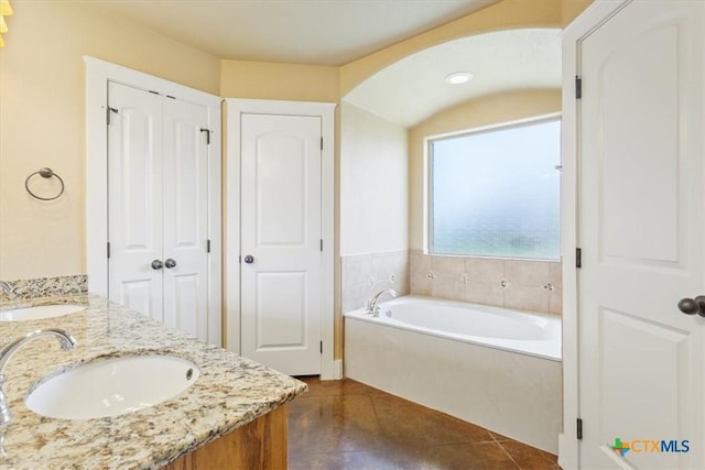 703 Cosper Creek Dr, Killeen, TX 76542 - full bath with a closet, a garden tub, double vanity, and tile patterned floors