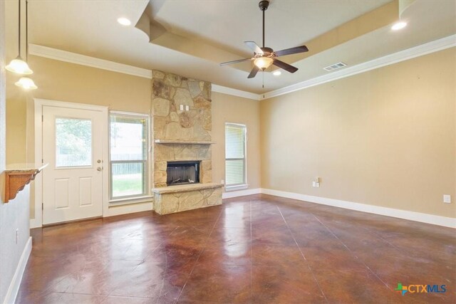 703 Cosper Creek Dr, Killeen, TX 76542 - unfurnished living room featuring crown molding, ceiling fan, a fireplace, a tray ceiling, and recessed lighting
