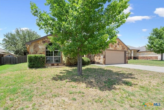 703 Cosper Creek Dr, Killeen, TX 76542 - view of property hidden behind natural elements featuring driveway, stone siding, and an attached garage