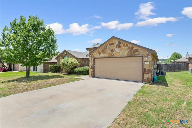 703 Cosper Creek Dr, Killeen, TX 76542 - single story home featuring a garage and stone siding