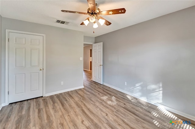 unfurnished bedroom featuring light hardwood / wood-style floors and ceiling fan