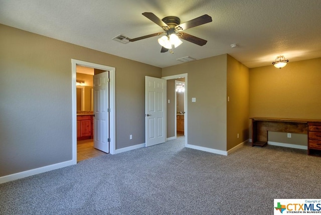 3037 Rustler, Canyon Lake, TX 78133 - unfurnished bedroom with light colored carpet, ensuite bathroom, an office area, and ceiling fan