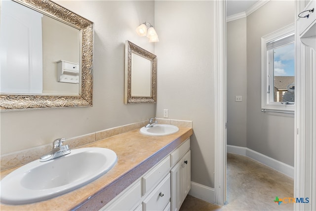 bathroom with ornamental molding and vanity