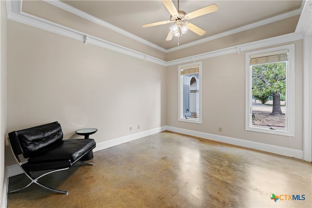 sitting room with concrete flooring, ceiling fan, and crown molding