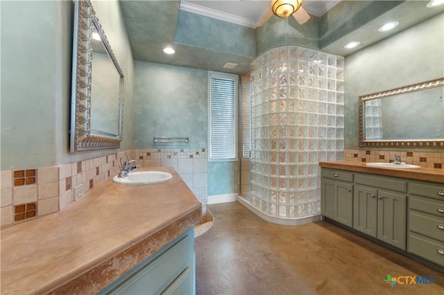 6529 Mountain View Dr, Killeen, TX 76549 - bathroom with ornamental molding, decorative backsplash, two vanities, finished concrete floors, and recessed lighting
