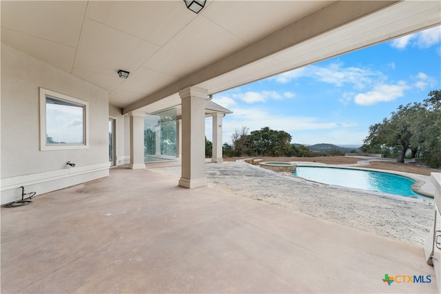 view of swimming pool with a patio