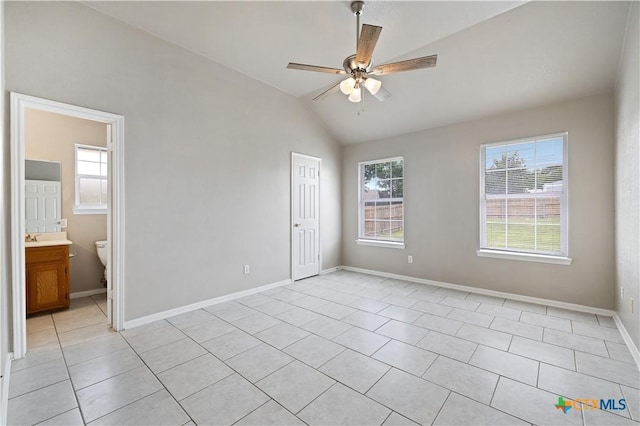 3805 Lone Oak Dr, Killeen, TX 76542 - unfurnished bedroom featuring vaulted ceiling, light tile patterned floors, ceiling fan, and connected bathroom