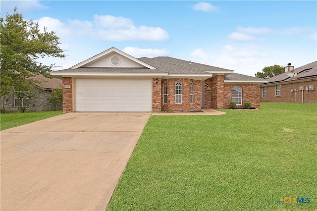 3805 Lone Oak Dr, Killeen, TX 76542 - view of front of house featuring concrete driveway, brick siding, a front lawn, a garage, and a shingled roof