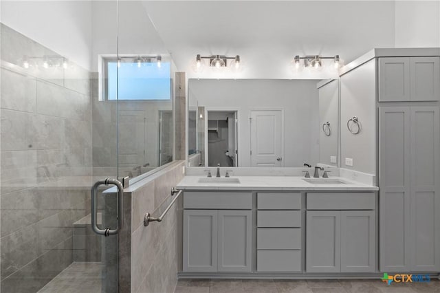 7912 Emery Oaks Dr, Temple, TX 76502 - full bathroom featuring a sink, double vanity, and a stall shower