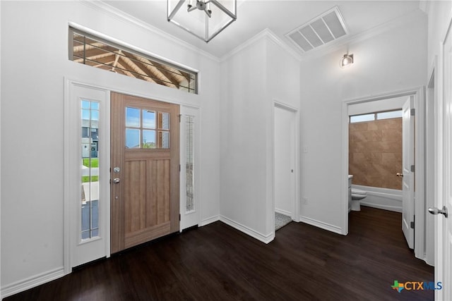 7912 Emery Oaks Dr, Temple, TX 76502 - foyer featuring visible vents, wood finished floors, baseboards, and ornamental molding