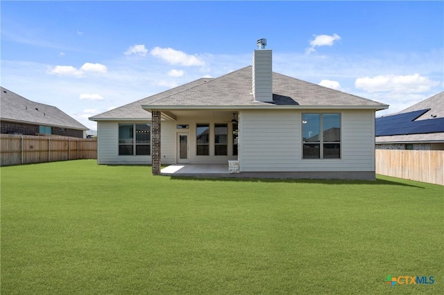 7912 Emery Oaks Dr, Temple, TX 76502 - rear view of house featuring a patio, a chimney, a lawn, and a fenced backyard