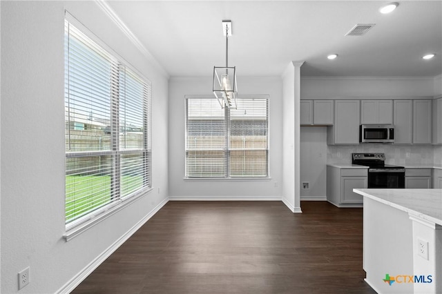 7912 Emery Oaks Dr, Temple, TX 76502 - kitchen featuring crown molding, a healthy amount of sunlight, and appliances with stainless steel finishes