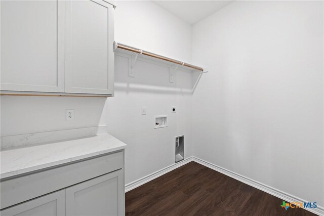 7912 Emery Oaks Dr, Temple, TX 76502 - laundry room with cabinet space, hookup for an electric dryer, dark wood finished floors, baseboards, and hookup for a washing machine