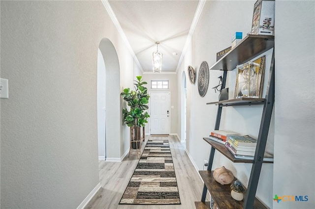 1444 Rolling Brook Dr, Temple, TX 76502 - entryway with crown molding, arched walkways, wood finished floors, and baseboards