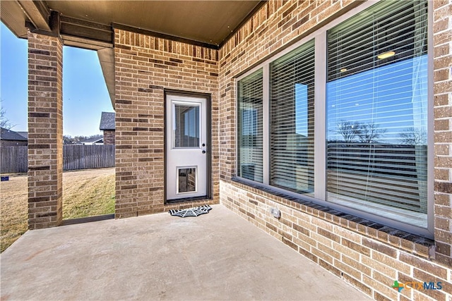 doorway to property featuring a patio area