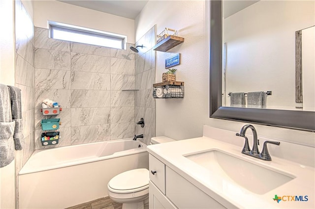 full bathroom featuring vanity, toilet, and tiled shower / bath