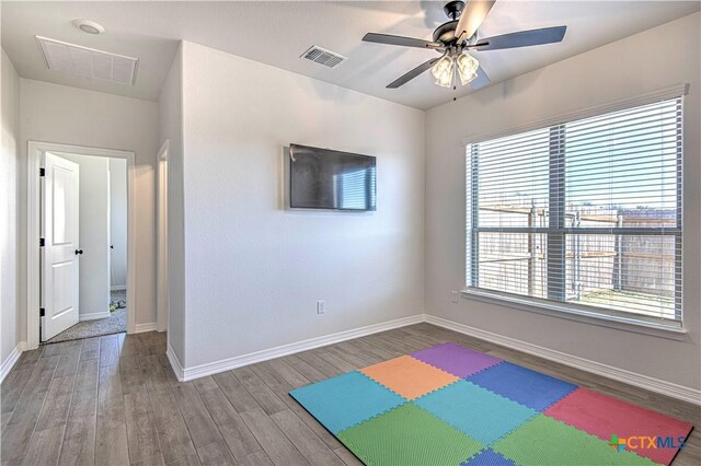 game room featuring hardwood / wood-style flooring and ceiling fan