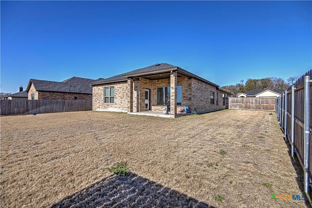 rear view of house with a patio area