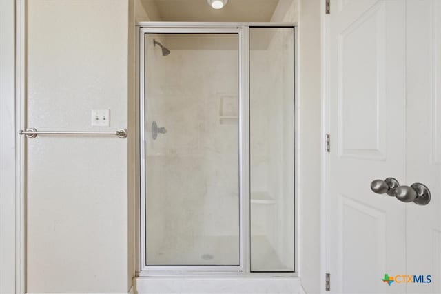 bathroom featuring an enclosed shower