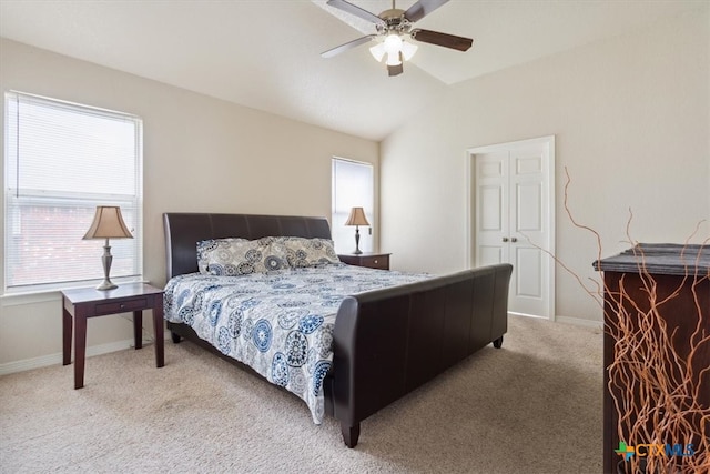 carpeted bedroom featuring lofted ceiling and ceiling fan