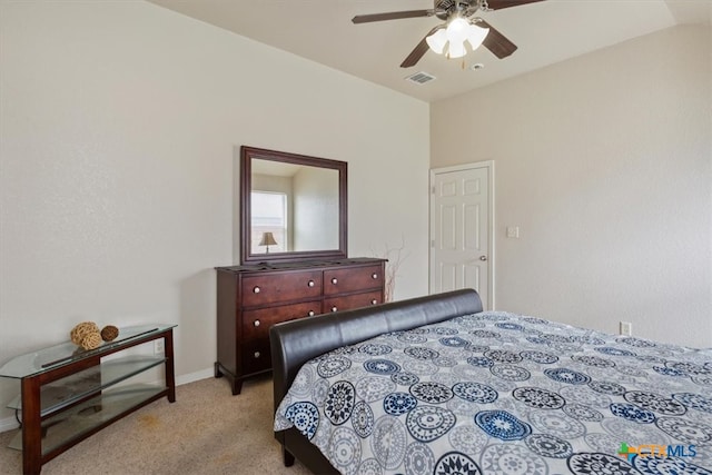 bedroom featuring ceiling fan, light carpet, and vaulted ceiling