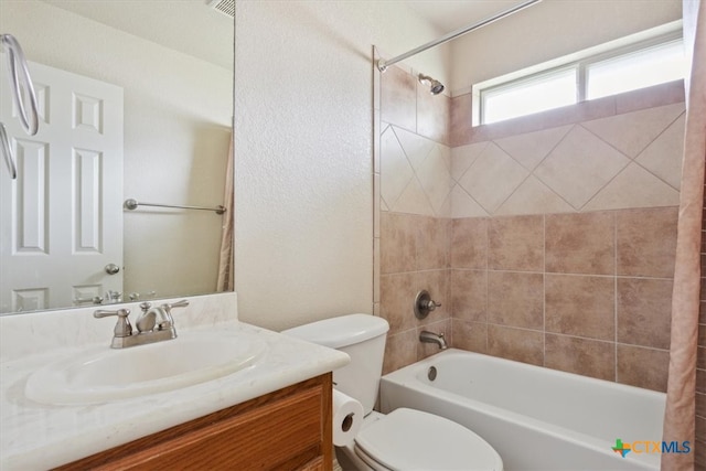 full bathroom with toilet, vanity, and shower / bath combination with curtain