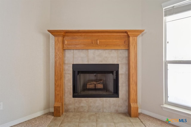 details featuring a fireplace and tile patterned flooring