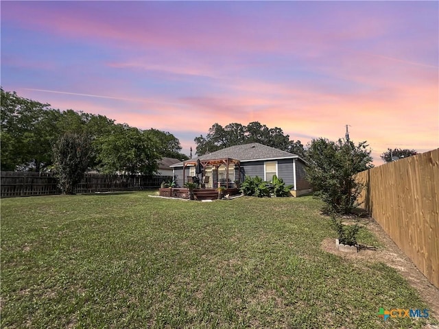 701 Clark St, Gonzales, TX 78629 - yard at dusk featuring a gazebo