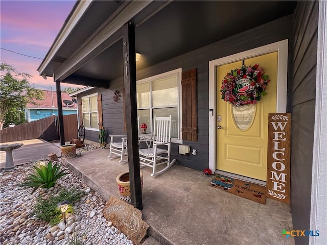 701 Clark St, Gonzales, TX 78629 - doorway to property featuring a porch