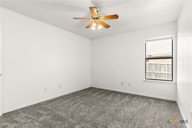 spare room with ceiling fan and carpet floors