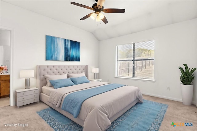 bedroom with vaulted ceiling, ceiling fan, and light colored carpet