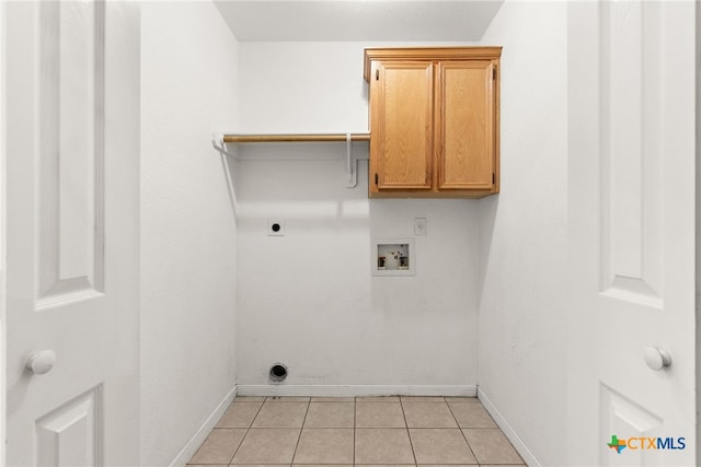 laundry room with cabinets, washer hookup, light tile patterned floors, and electric dryer hookup