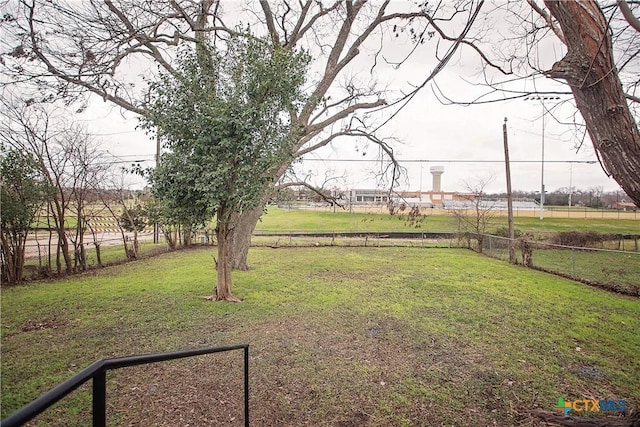 view of yard with a rural view