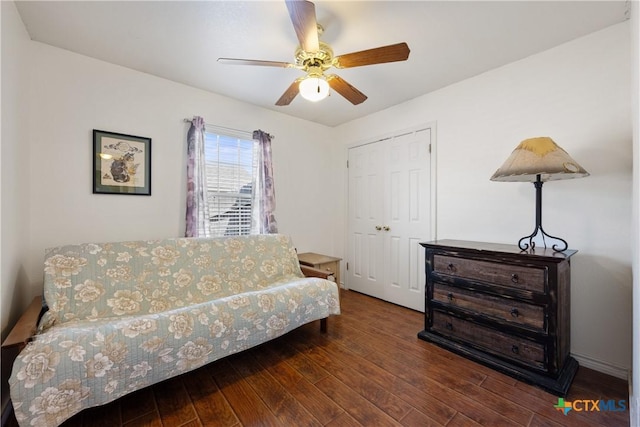 sitting room featuring hardwood / wood-style floors and ceiling fan