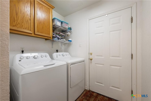 laundry room with cabinet space and independent washer and dryer