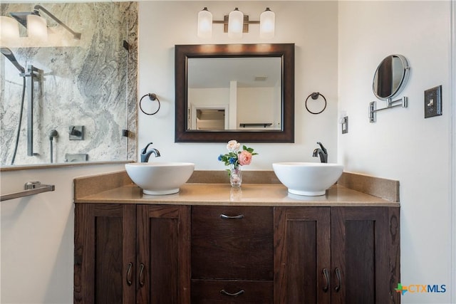 bathroom with double vanity and a sink