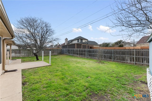 view of yard with a patio and a fenced backyard