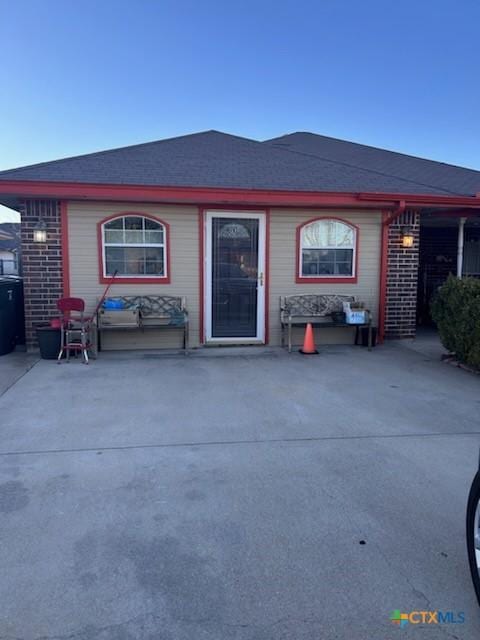 entrance to property with brick siding