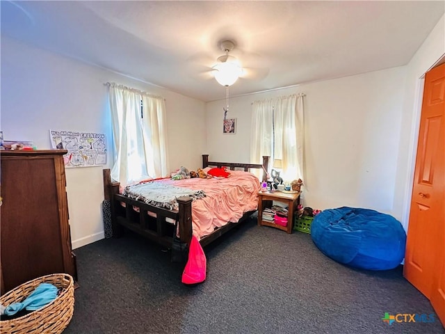 carpeted bedroom with ceiling fan